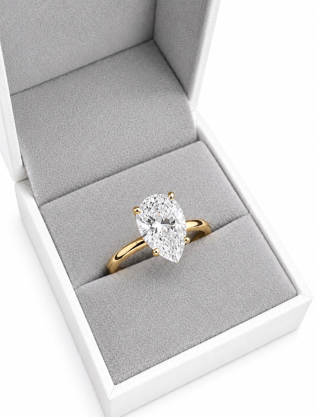 SOTTOZERO PEAR RING – 2CTW DVVS1/CB MOISSANITE, 925 SILVER & 14K WHITE VERMEIL